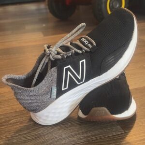New Balance kids size 4 or women’s 6 Black and White Sneakers